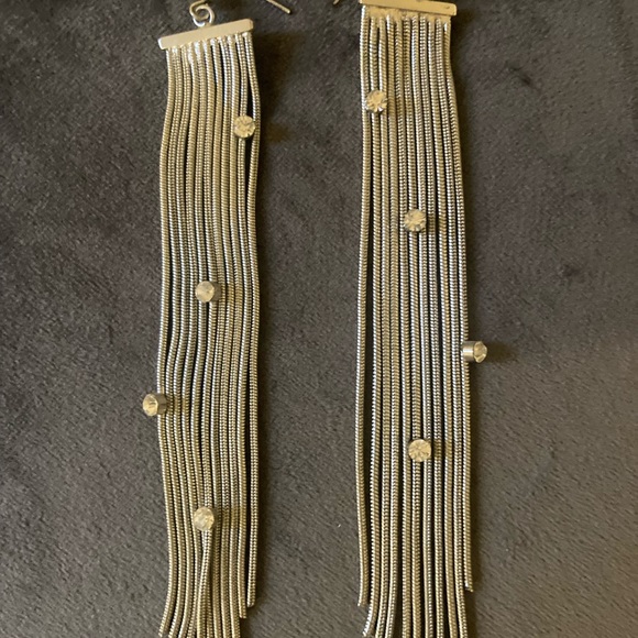 Silver like earrings, with crystal accents. - Picture 2 of 4